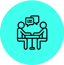 Two people talking at a table icon.
