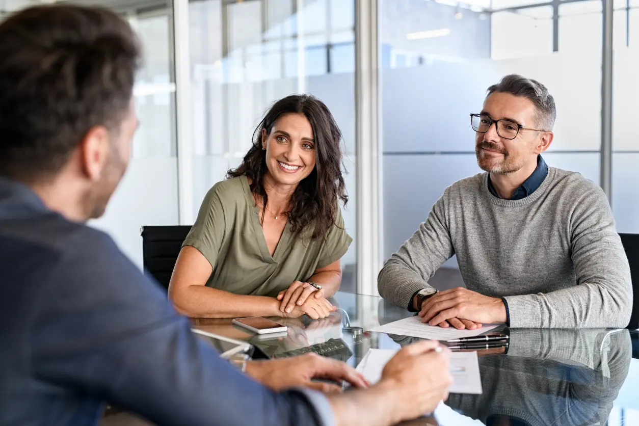Three people having a business meeting.