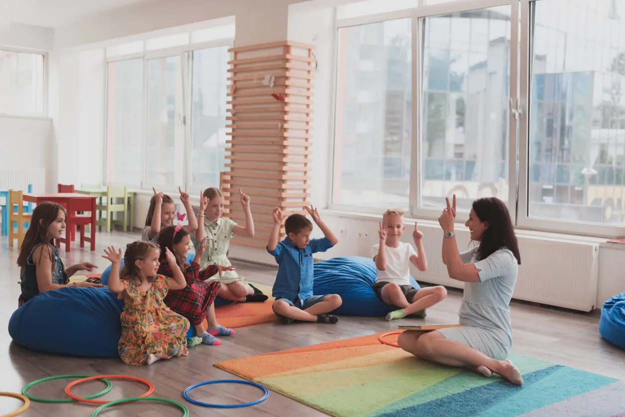 Children in classroom doing seated activities.